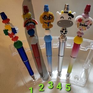 Hand beaded with silicone beads and beautiful rhinestones ink pens.